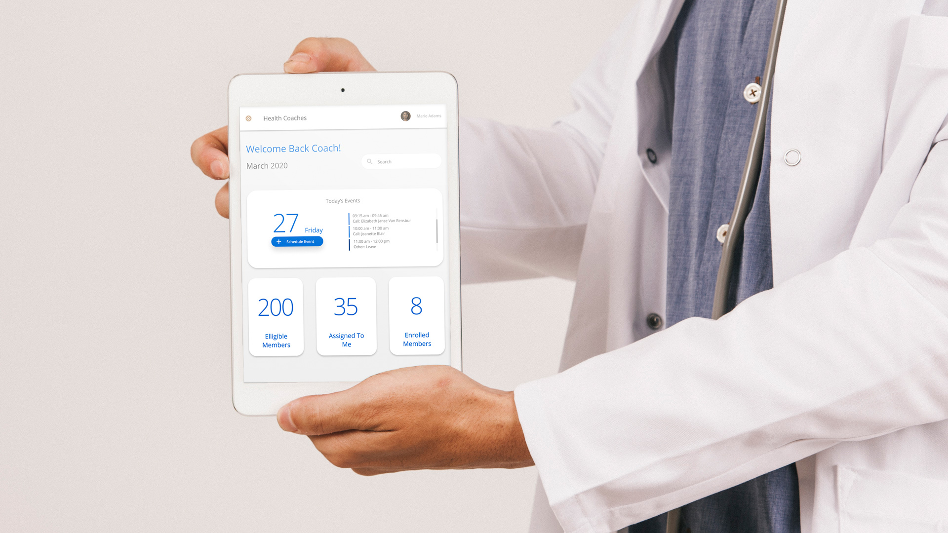 A healthcare practitioner holding up an ipad displaying the Health Coaches app on the Discovery Digital Health Platform.  