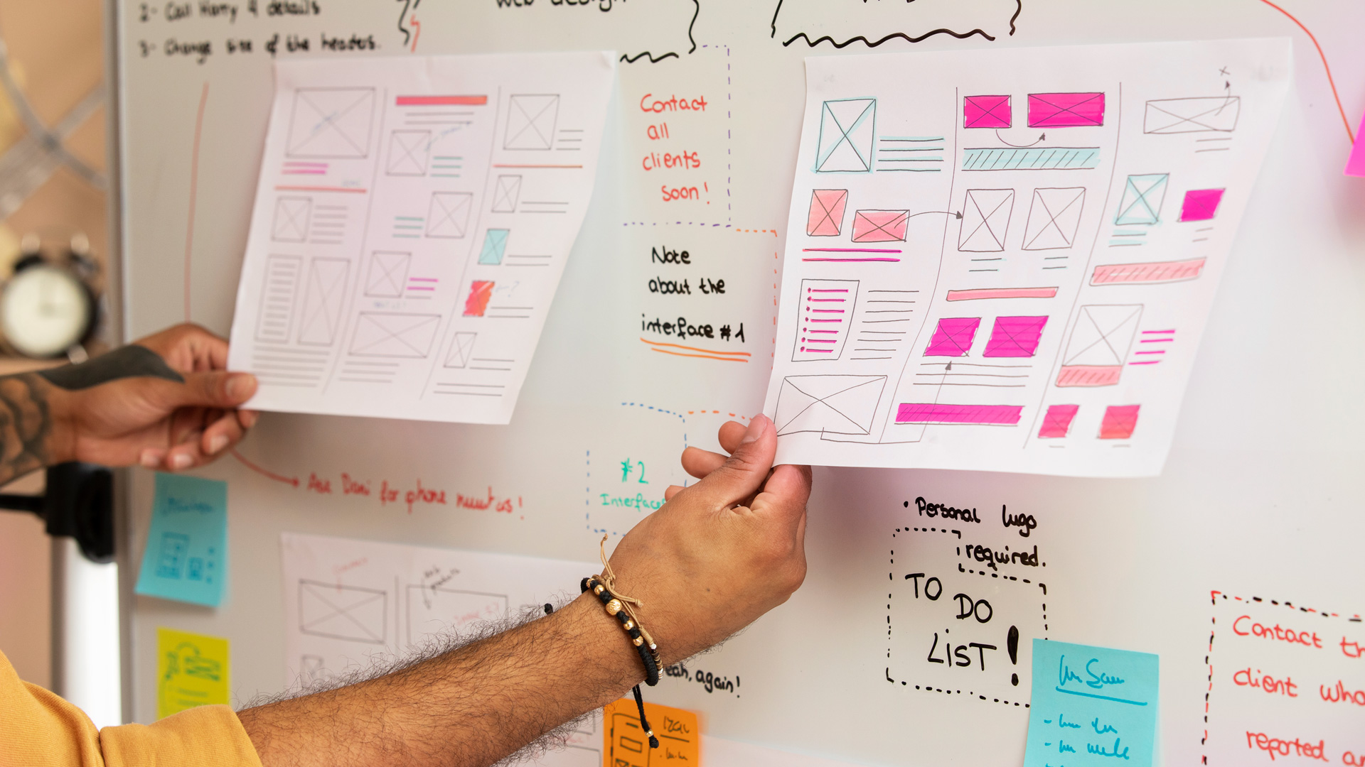 UX designer performing UX strategy work on a whiteboard.